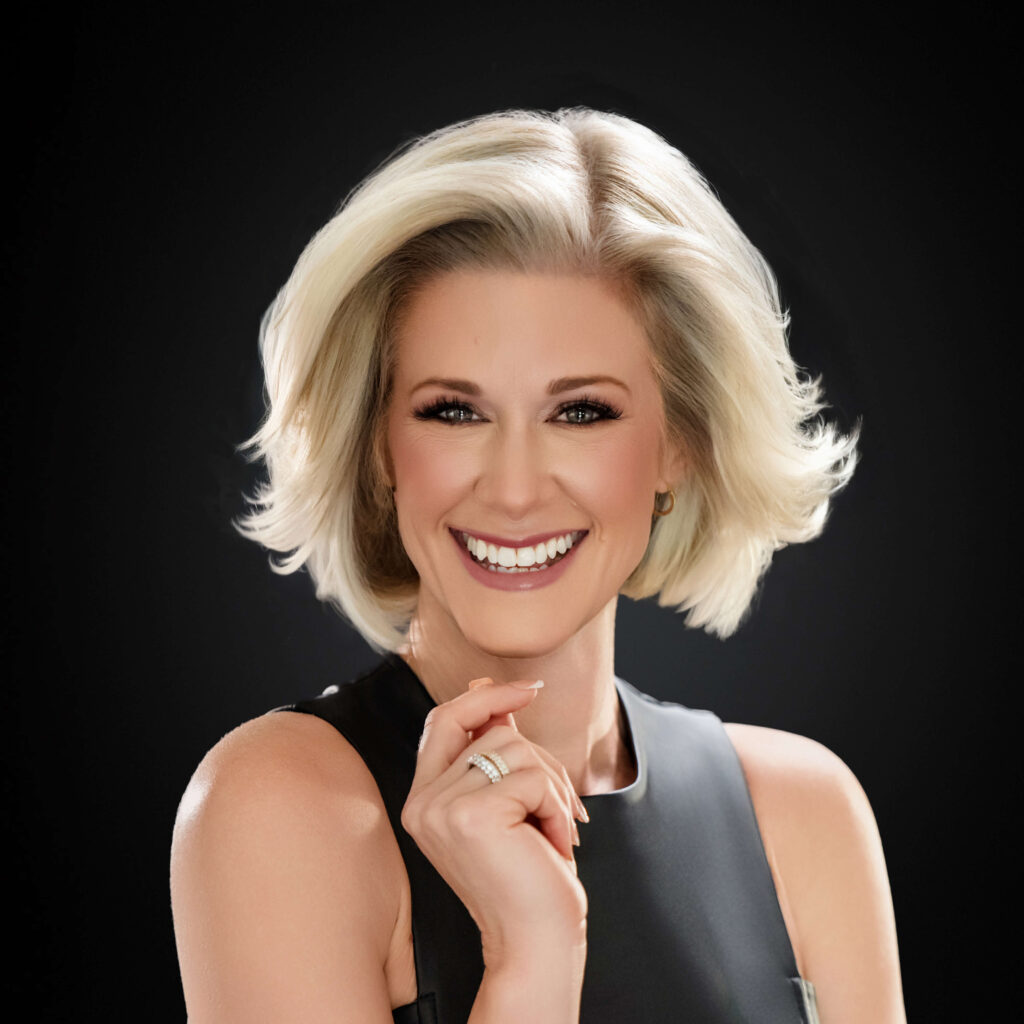 Professional headshot of a real estate agent in Birmingham, Alabama captured by Breanne Fine Portraiture. Studio-lit portrait featuring confident pose, modern styling, and clean black background—ideal for branding and personal marketing.