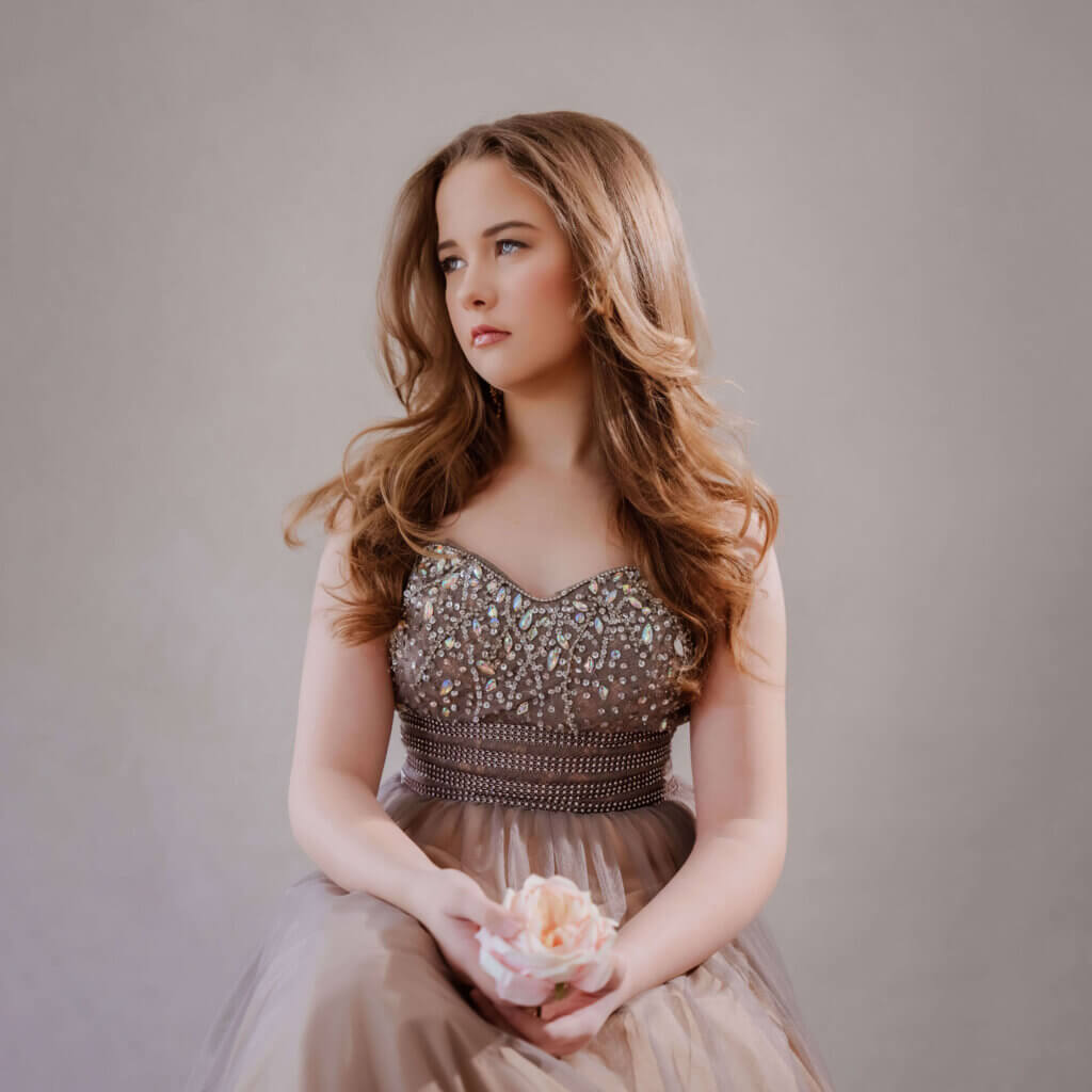 Children’s heirloom portrait in formal gown holding flower, Birmingham photographer
