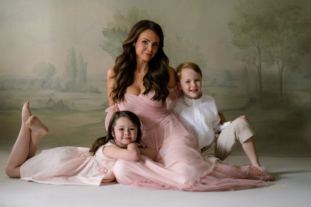 Aereal Runyans in a pink tulle gown with Coleman and Callaway during their fine art family portrait session near Birmingham, Alabama.