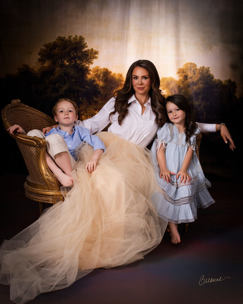 Aereal Runyans seated with her young son Coleman and daughter Callaway in a painterly family portrait in Trussville, Alabama.