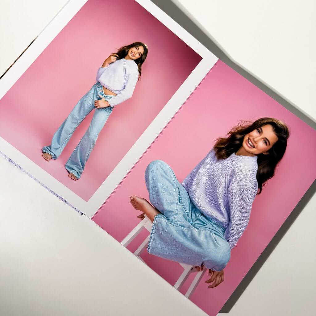 Ireland's custom Atelier Album with a portrait cover, thick pages, and a blue presentation case for her modeling portfolio presentation and personal keepsake from Breanne Fine Portraiture in Birmingham Alabama