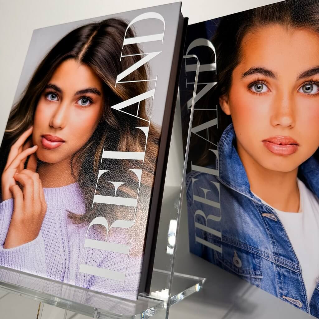 Ireland's custom Atelier Album with a portrait cover, thick pages, and a blue presentation case for her modeling portfolio presentation and personal keepsake from Breanne Fine Portraiture in Birmingham Alabama